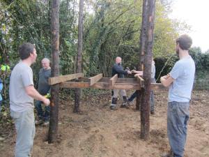 Hugo and Gavin stand back while the others are busy at work making the toilet base